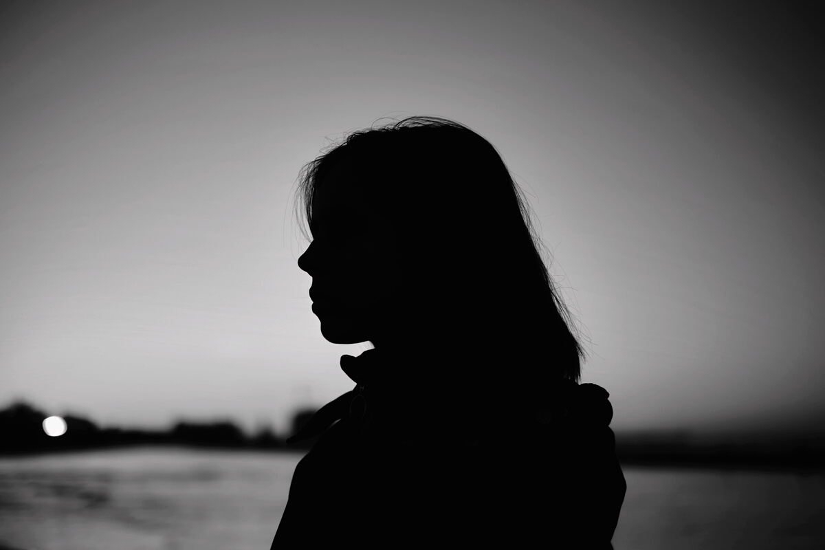 Silhouette of a Woman During Sunset